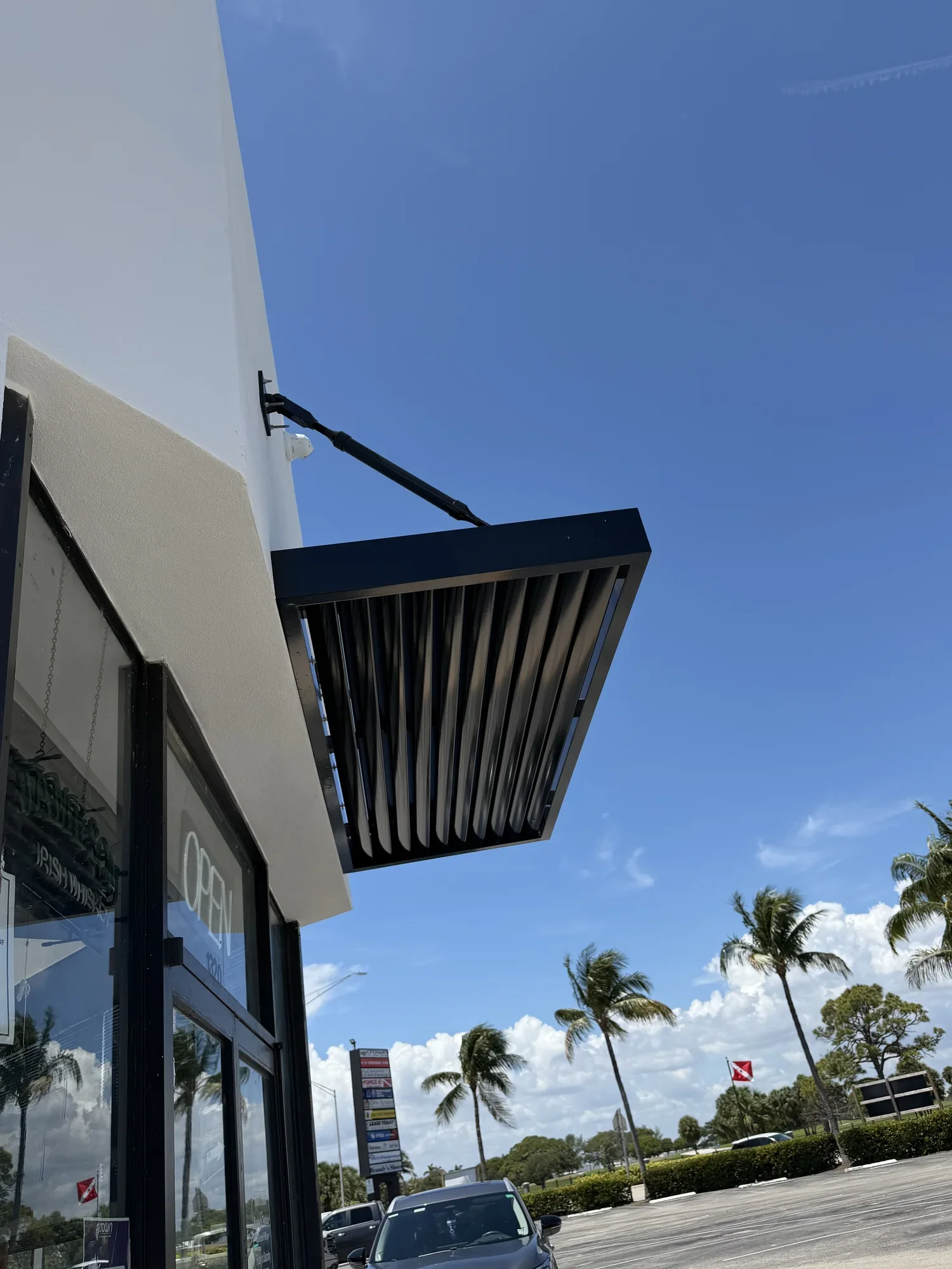 overhead hanging arm canopy retail storefront